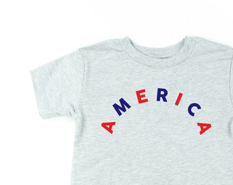 AMERICA (Arched) - Red + Blue - Short Sleeve Child Shirt | 4th of July | Kids Patriotic Shirt | Kids Graphic Tee | Memorial Day Shirt