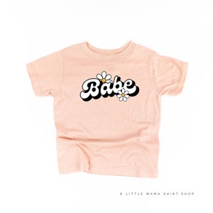 DAISY - BABE - w/ Full Daisy on Back - Short Sleeve Child Shirt | Girls Graphic Tee | Retro Flower Shirts | Daisy Shirt | Girls Graphic Tee