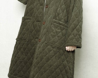 May include: A long, quilted, olive green corduroy coat with a button closure and two large pockets. 