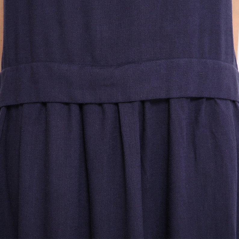 May include: A navy blue dress with a gathered skirt and a waistband.