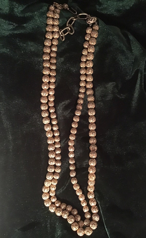 Gold beaded necklace - image 1