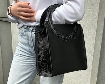 Lederhandtasche, schwarze runde Griffhandtasche, Handtasche im minimalistischen Stil, Geschenk für Frau, lässige Handtasche für sie