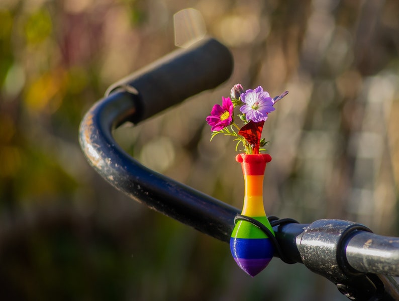 little vase for on your bike. Bike has the colors of the rainbow.