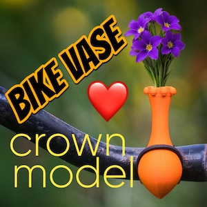 Könnte beinhalten: Eine orangefarbene Fahrradvase mit einem schwarzen Band, die lila Blumen hält. Der Text "BIKE VASE" und "crown model" sind in Gelb dargestellt. Ein rotes Herz ist ebenfalls vorhanden.