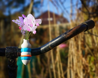 1x two-color bike vase bulb version.  Colored White-Lblue, or choose your combo and elastic binder color