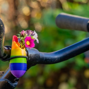 little vase for on your bike. Bike has the colors of the rainbow.