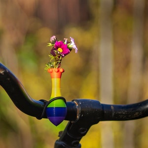 little vase for on your bike. Bike has the colors of the rainbow.