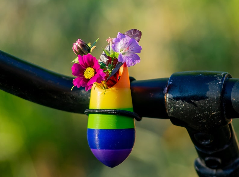 little vase for on your bike. Bike has the colors of the rainbow.