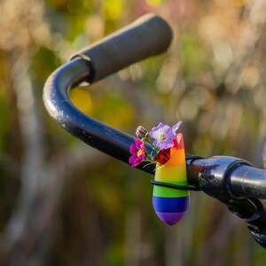 little vase for on your bike. Bike has the colors of the rainbow.