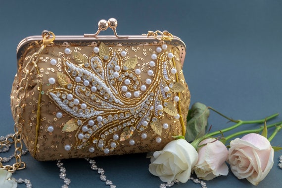 gold embellished clutch bag