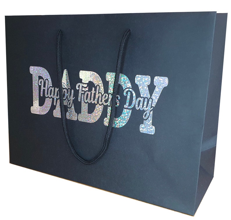 May include: Black gift bag with a holographic silver design that says "Happy Father's Day Daddy".