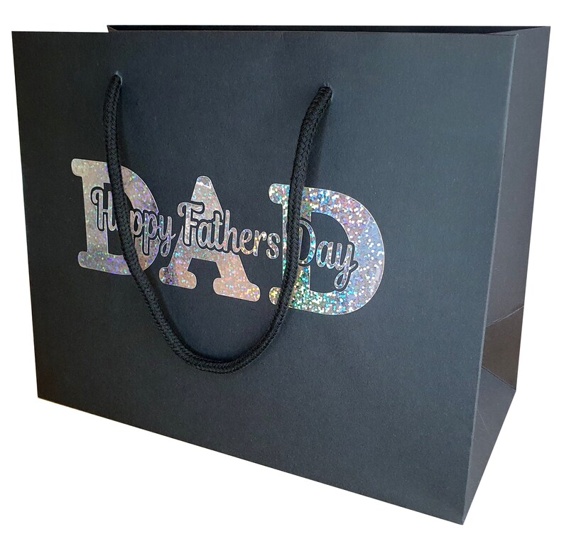 May include: Black gift bag with a silver glitter design that says "Happy Father's Day DAD".