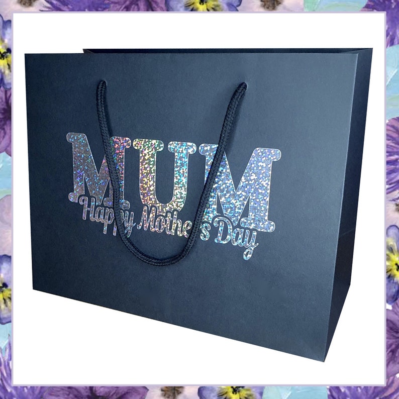 May include: Black gift bag with a silver glitter design that says "MUM Happy Mother's Day".