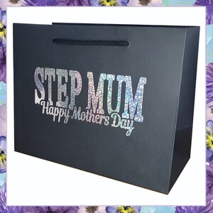 May include: Black gift bag with a silver glitter design that says "Step Mum Happy Mothers Day".
