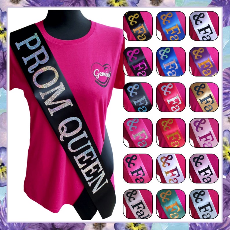 May include: A black satin sash with the text "PROM QUEEN" in silver glitter. The sash is worn diagonally across a pink t-shirt with a small heart design. The image also shows a variety of sash colors, including blue, purple, gold, red, white, and teal.