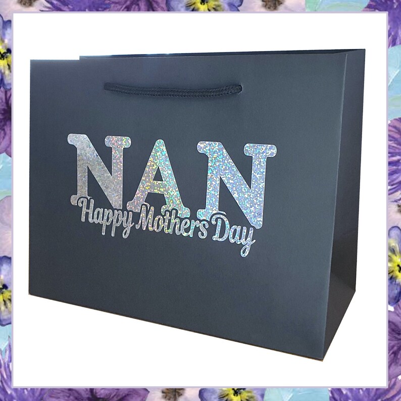 May include: A dark gray gift bag with a silver glitter design that says "NAN Happy Mothers Day".