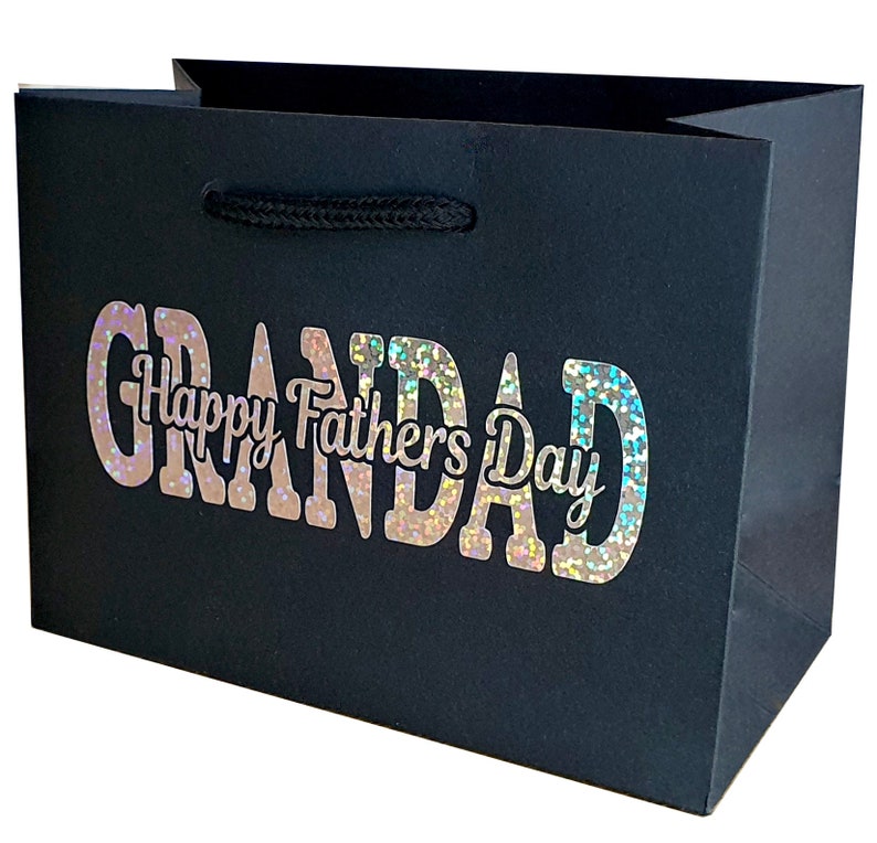 May include: Black gift bag with a holographic silver glitter design that says "Grandad Happy Father's Day".