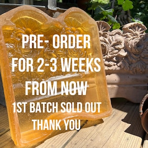 May include: A translucent amber-colored resin tray featuring a molded floral pattern on its surface. The tray has a rectangular shape with rounded corners and a raised edge. White text is overlaid on the tray reading PRE-ORDER FOR 2-3 WEEKS FROM NOW 1ST BATCH SOLD OUT THANK YOU.