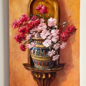 May include: A painting of a bouquet of pink and red carnations in a decorative ceramic vase on a wooden shelf. The shelf is attached to a wall with a gold frame.