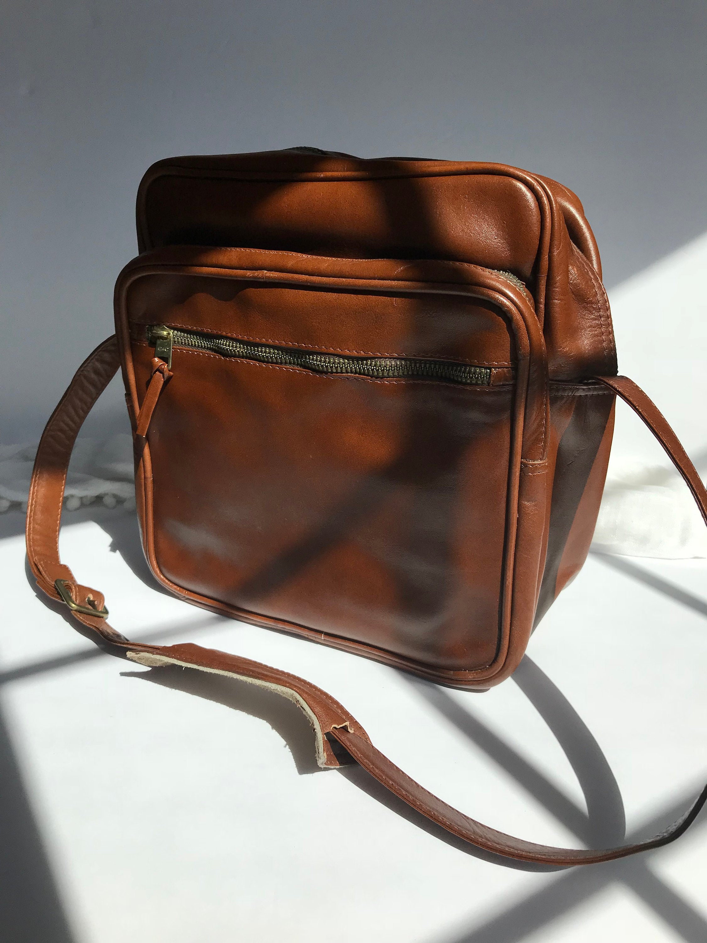 tumi leather carry on