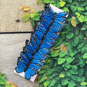 Juego de 12 mariposas de plumas monarca con purpurina en alambre para  arreglos florales y decoraciones de bricolaje (azul/dorado)