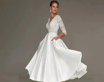 Robe de mariée longueur thé ivoire chic moderne | Dentelle à col en V | en satin à manches trois-quarts | Robe de mariée avec poche | Robe de mariée courte