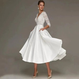 Robe de mariée longueur thé ivoire chic moderne Dentelle à col en V en satin à manches trois-quarts Robe de mariée avec poche Robe de mariée courte image 1