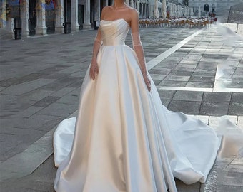 Abito da sposa elegante con spalle scoperte / Strascico senza maniche / Raso / Lunghezza pavimento / Abito da principessa / Abito da sposa moderno / Abito da sposa / Abito da sposa