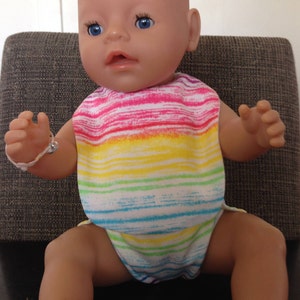 Dolls clothes; dolls nappy and bib; Baby Born clothes; Pretend play babies; Pretend play mums and dads; nappy change; rainbow colours