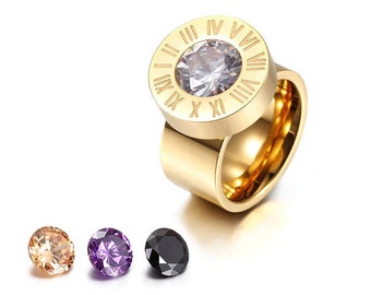Roman numeral engraved ring in yellow gold finish with four interchangeable stones; clear, black, purple, champagne