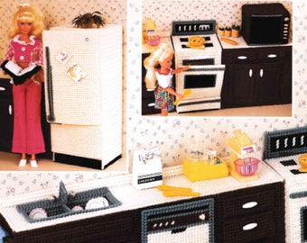May include: A dollhouse kitchen playset with a white and brown color scheme. The kitchen includes a sink, dishwasher, oven, and cabinets. There are also several accessories, such as a mixer, dishes, and a pie.