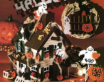 May include: A handmade Halloween decoration featuring a house, pumpkins, ghosts, and a wreath. The house is adorned with jack-o'-lanterns and spiderwebs. The words "Happy Halloween Party" are displayed above the house.