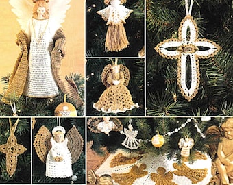 May include: A collection of handmade Christmas ornaments and tree decorations. The image features crocheted angels, crosses, and a tree skirt in white and gold tones. The angel tree topper has a porcelain face and fabric wings.