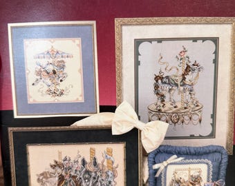 2 cross stitch booklets, Mythical moments, Carousel magic