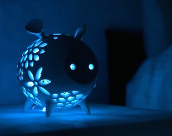 Ceramic piggy night light.  Handmade porcelain pig with multicolor LED fairy lights,