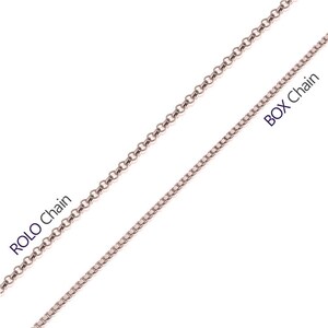 May include: Two types of silver chains, a rolo chain and a box chain. The rolo chain is a round, linked chain. The box chain is a square, linked chain.