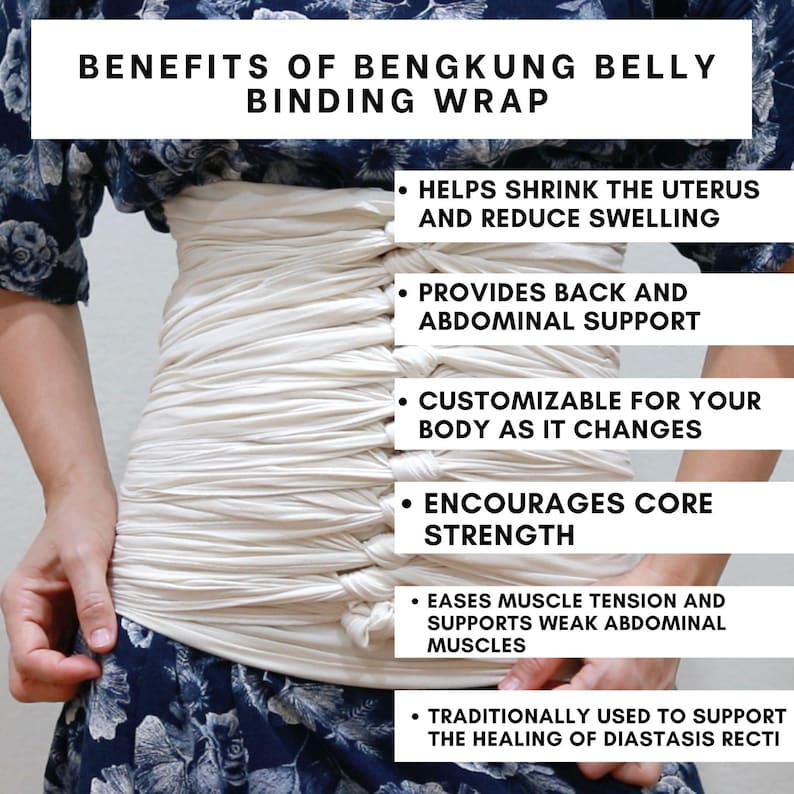 May include: A white belly binding wrap is shown being worn by a person. The wrap is made of a soft, stretchy fabric and is designed to provide support to the abdomen and back. The text on the image reads: "Benefits of Bengkung Belly Binding Wrap" and lists the benefits of wearing the wrap, including helping to shrink the uterus and reduce swelling, providing back and abdominal support, being customizable for the body as it changes, encouraging core strength, easing muscle tension and supporting weak abdominal muscles, and being traditionally used to support the healing of diastasis recti.