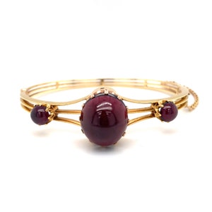 Circa 1890s 28.92 Carat Cabochon Garnet Bangle in 18 Karat Yellow Gold, FD#1894-ATL