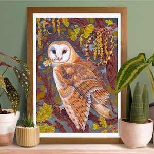 May include: Framed art print featuring a detailed illustration of a barn owl perched on a tree branch. The owl has brown and white feathers, with a sprig of flowers in its beak. The artwork is set against a dark, starry background with yellow and green foliage.
