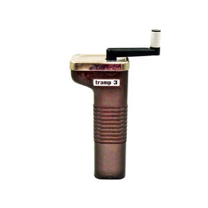 May include: A brown and silver hand crank grinder with the text "tramp 3" on the side.