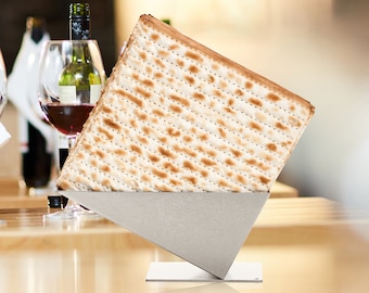 A set of two modern metal matzah holders for the Passover table. Festive centerpieces shaped as Pyramids. Color: Gray/Silver. Value pack.