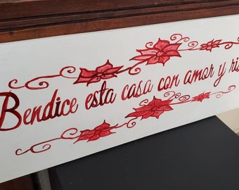 Letrero en español: Bendice este hogar con amor y risas