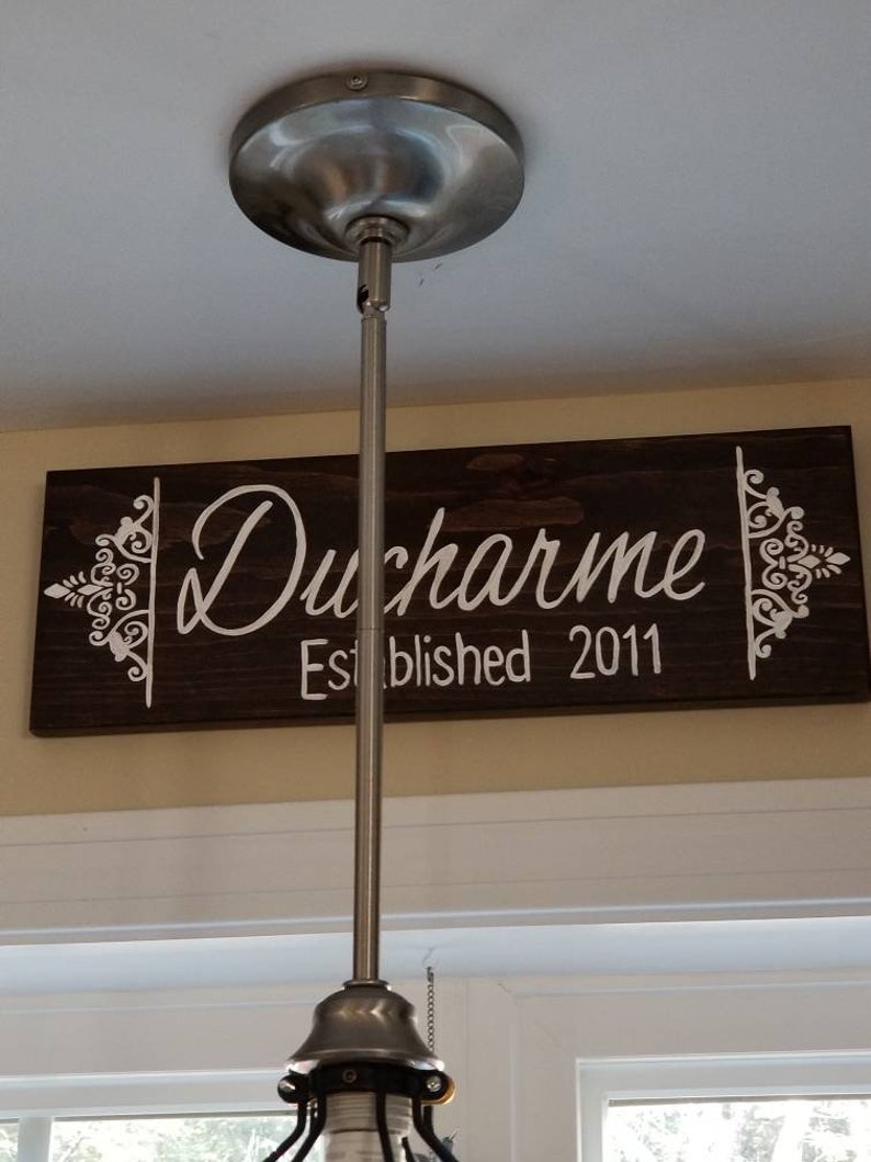 Beautiful name sign makes a great housewarming gift. Family name wooden signs with your established date