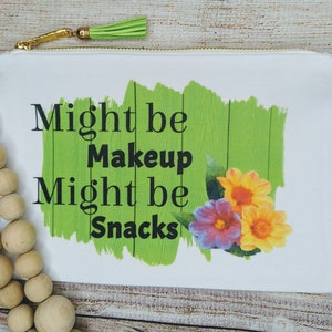 Might be makeup might be snacks zippered pouch with tassel