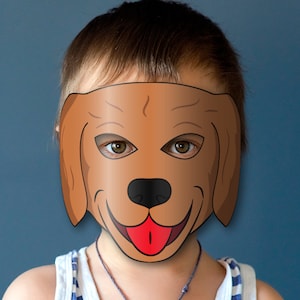 May include: A child wearing a brown dog mask with black eyes, a black nose, and a red tongue. The mask has floppy ears.