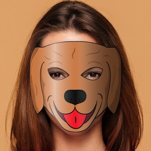 May include: A brown dog mask with black eyes and a red tongue. The mask is made of paper and has a simple design.