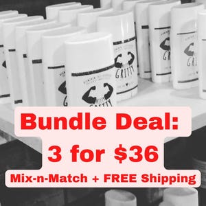 May include: White deodorant sticks with black and white labels featuring a flexing arm graphic and the word "GRITTY". The image shows multiple sticks arranged on a shelf. The text "Bundle Deal: 3 for $36" is also visible.