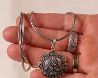 Experience the powerful blessings of Lord Jagannath with this pure 925 sterling silver pendant. A potent symbol of divine strength and grace