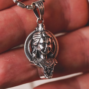 Wear the divine grace of Ram Lalla with this powerful 925 sterling silver pendant. Made of 925 sterling silver.  Religious Jewelry