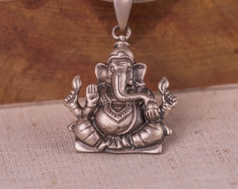 Discover this beautifully crafted pure silver pendant depicting Lord Ganesha, the auspicious deity, complete with a matching silver chain.